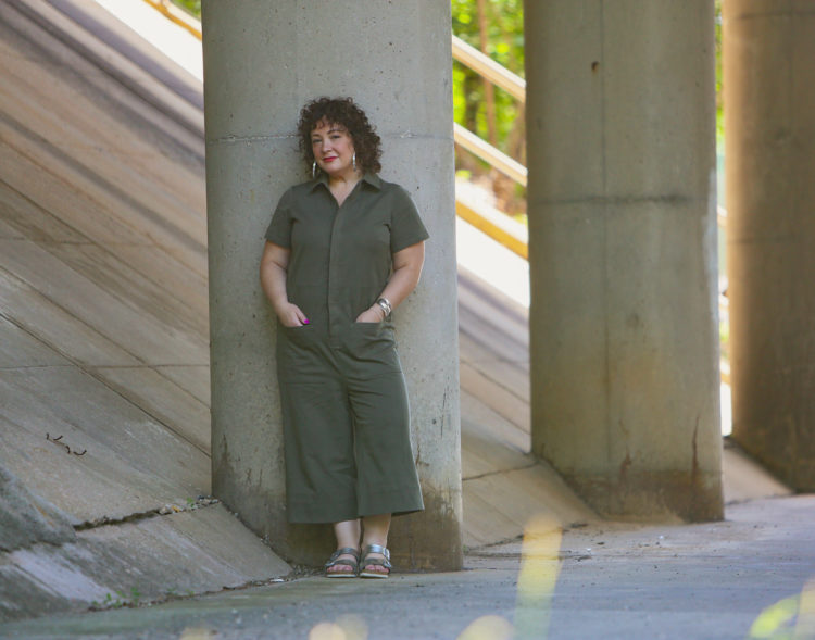 Wardrobe Oxygen in the Universal Standard Kate Twill Jumpsuit in green with silver Birkenstocks and the Jenny Bird Cober Hoops in Silver