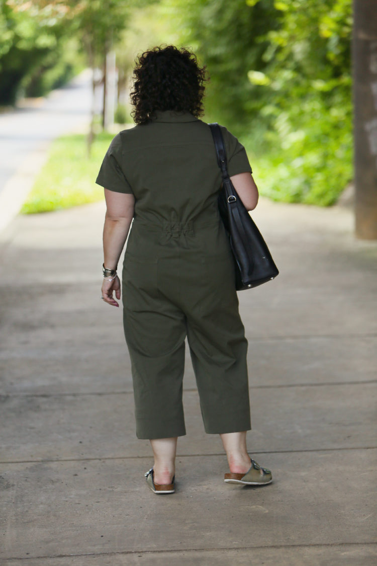 Wardrobe Oxygen in the Universal Standard Kate Twill Jumpsuit in green with silver Birkenstocks and the Jenny Bird Cober Hoops in Silver