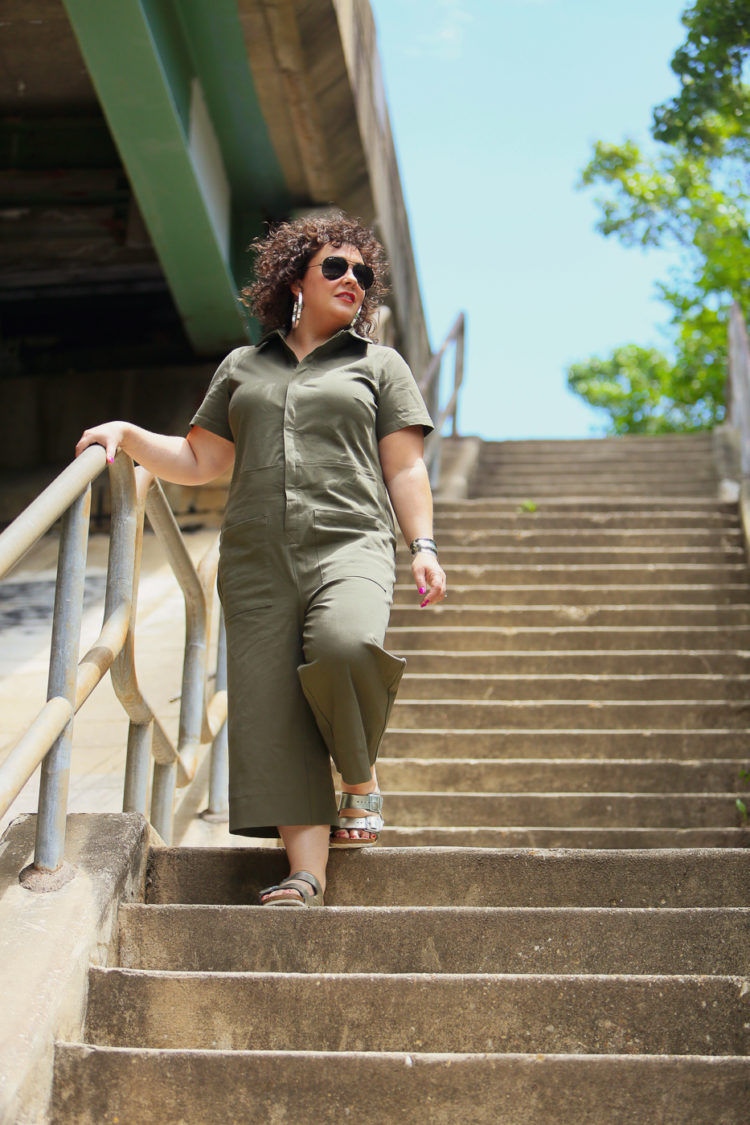 Wardrobe Oxygen in the Universal Standard Kate Twill Jumpsuit in green with silver Birkenstocks and the Jenny Bird Cober Hoops in Silver