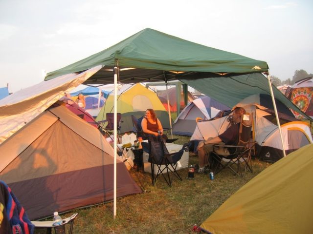 two tents connected by an EZ up shade shelter