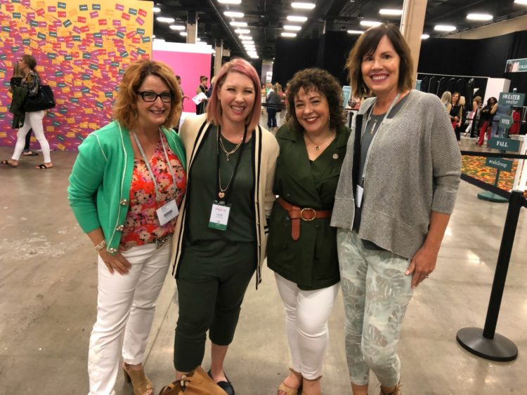 four women smiling together at the Hub at cabi Scoop 2019