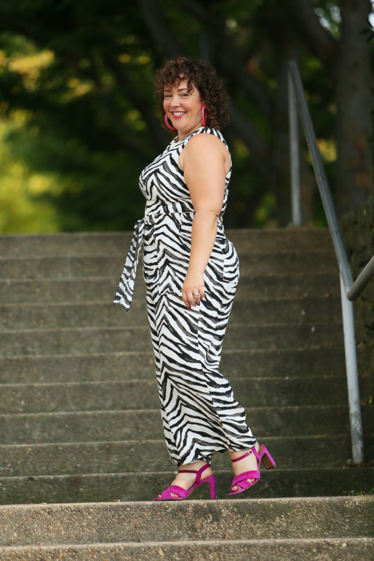 Wardrobe Oxygen in a zebra print jumpsuit from Banana Republic with a highlighter yellow Dagne Dover bag and hot pink heels and BaubleBar lucite hoops