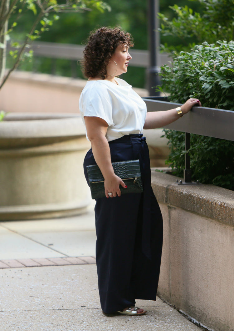 Wardrobe Oxygen in the Universal Standard Tresa Wide Leg pants and Viva Boatneck with Jenny Bird jewelry and a Clare V. Foldover Clutch 