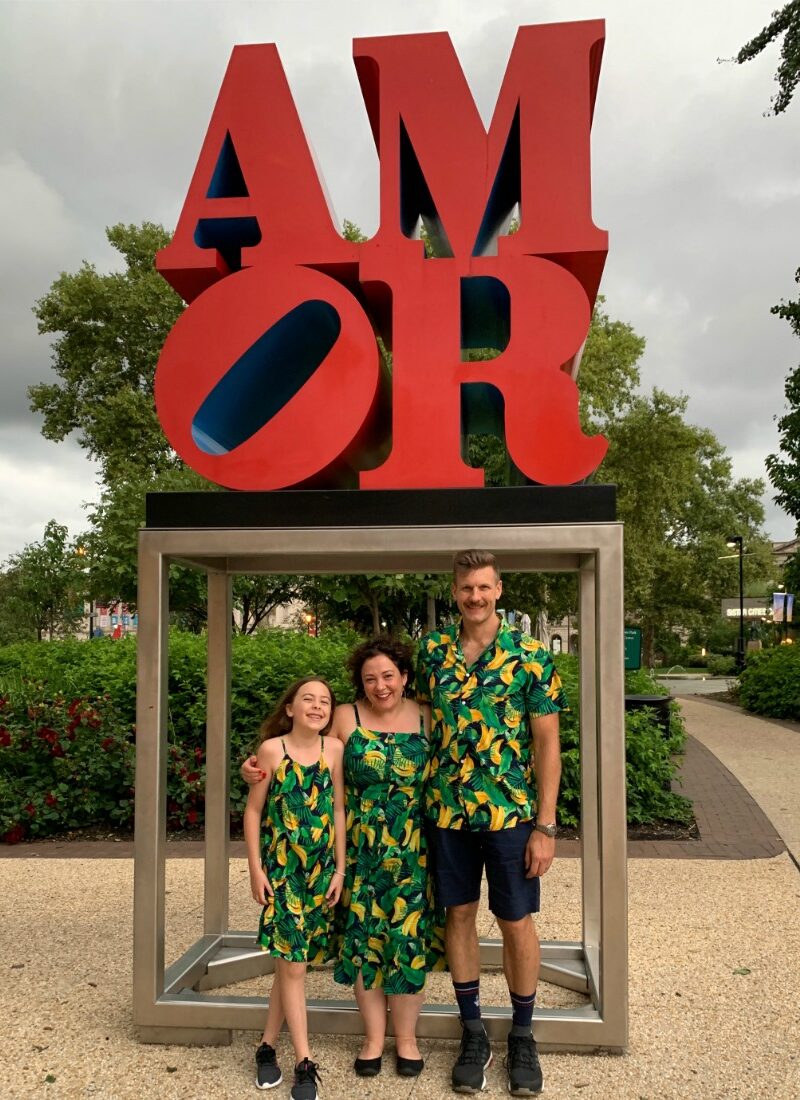 A family standing at the AMOR sculpture in Philadelphia