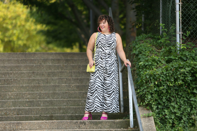 Wardrobe Oxygen in a zebra jumpsuit from Banana Republic with a highlighter yellow Dagne Dover bag and hot pink heels and BaubleBar lucite hoops