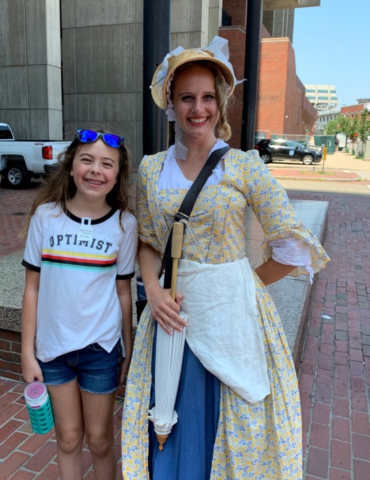 Emerson with a tour guide dressed in colonial garb