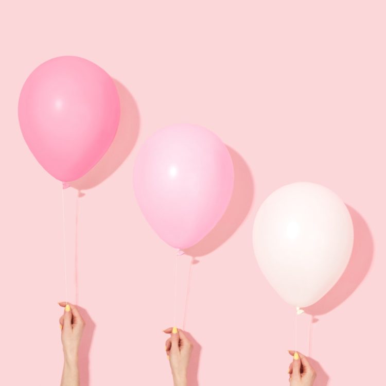 Weekend Reads #72 1 three hands in front of a pink background each holding a balloon