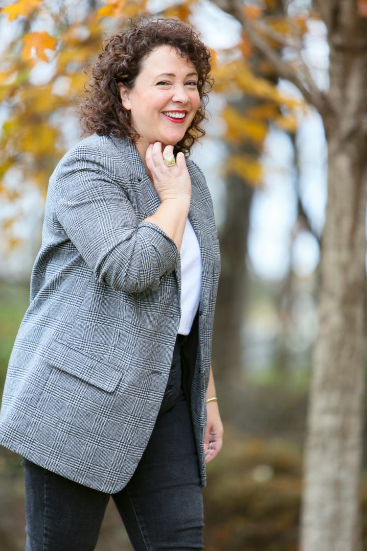 Alison Gary of Wardrobe Oxygen wearing a white t-shirt with a gray plaid oversized blazer from Everlane