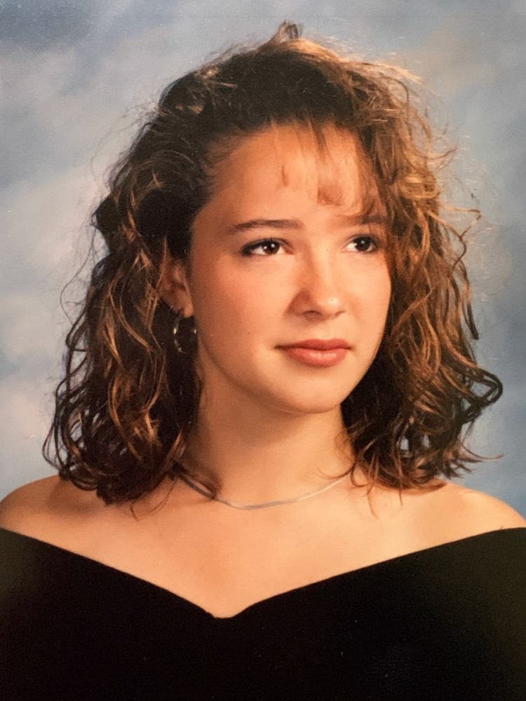 high school graduation photo of Alison Ashpes Gary with gelled curls