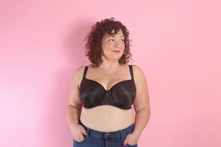 woman in black molded cup bra and a pair of high waist jeans