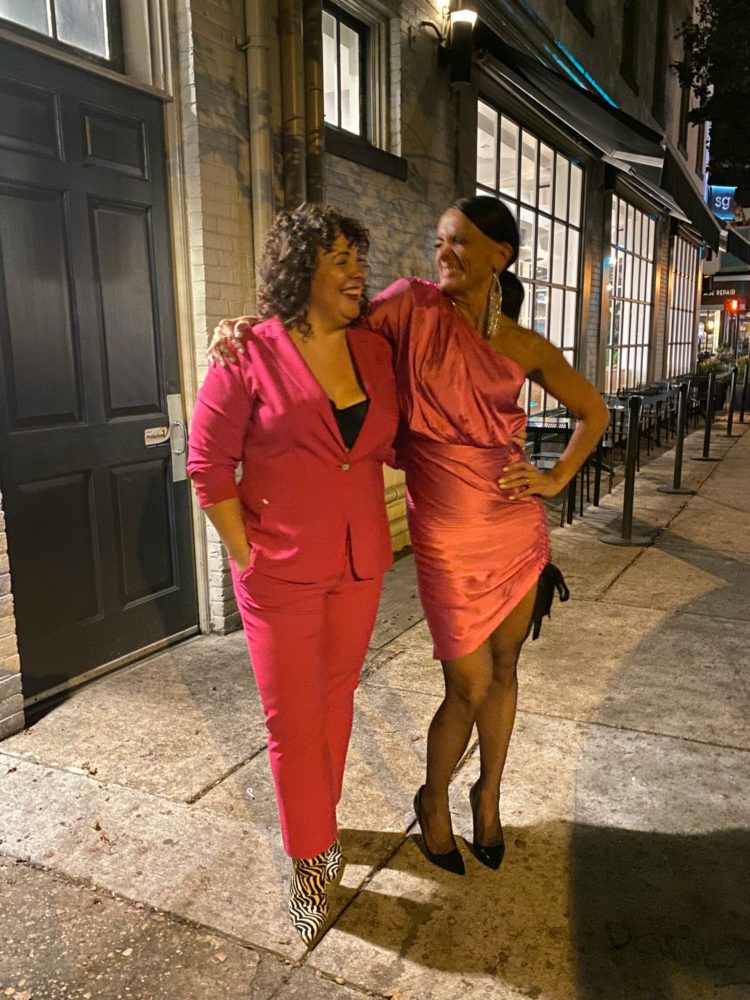Wearing a pink pantsuit with zebra print booties to the Blonde in the District 5-year anniversary party at The People's Drug in Alexandria, Virginia. What to wear to a pink-themed party