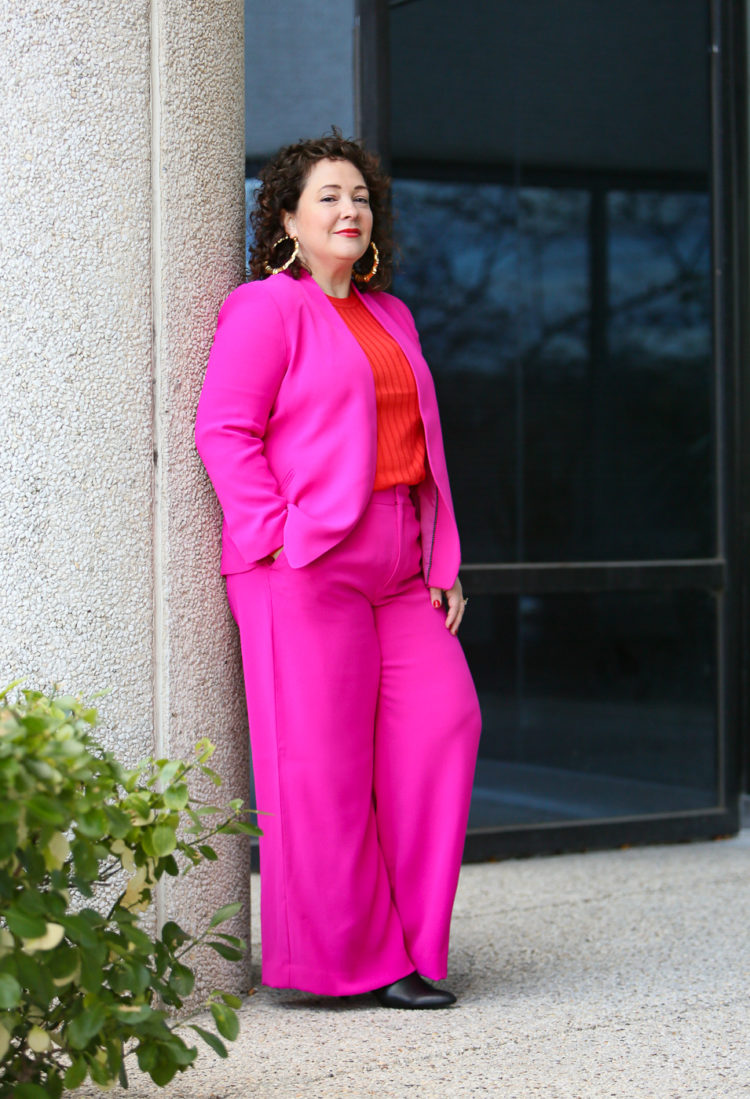 hot pink wide leg pantsuit from Banana Republic with an orange red merino wool crewneck sweater and leopard faux fur coat as seen on over 40 fashion blogger wardrobe oxygen