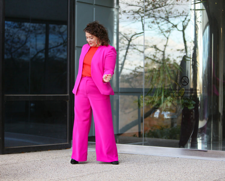 hot pink wide leg pantsuit from Banana Republic with an orange red merino wool crewneck sweater and leopard faux fur coat as seen on over 40 fashion blogger wardrobe oxygen