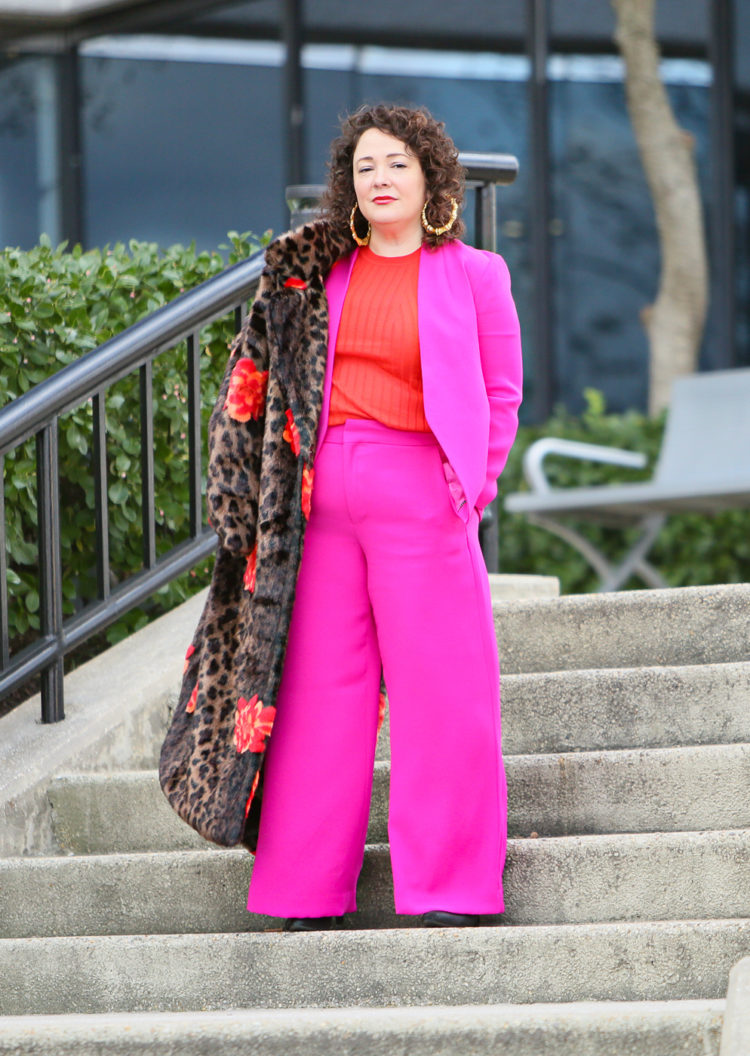 hot pink wide leg pantsuit from Banana Republic with an orange red merino wool crewneck sweater and leopard faux fur coat as seen on over 40 fashion blogger wardrobe oxygen