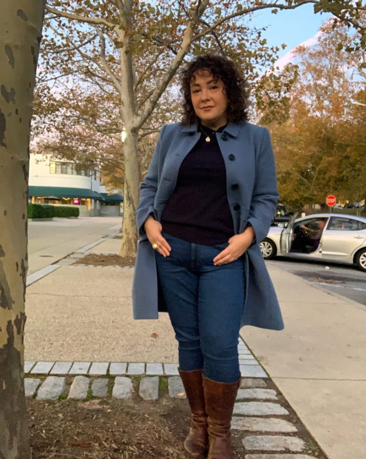 Wardrobe Oxygen in a blue wool lady coat and navy cashmere sweater both from Talbots with Everlane jeans and wide calf riding boots