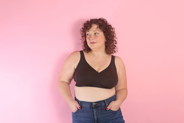 Woman in a black cotton nowire bra looking away from the camera