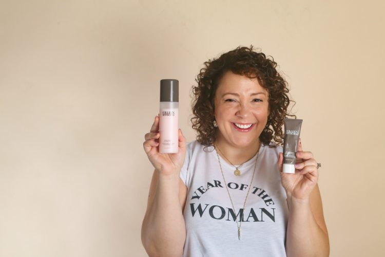 woman holding beauty products from Colleen Rothschild