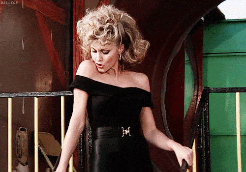GIF of Olivia Newton-John as Sandy in the movie Grease. It is at the end of the film when she is wearing leather-look leggings and dancing at the carnival
