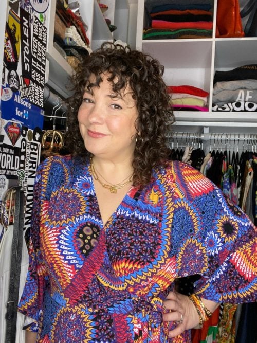 Wardrobe Oxygen | Real-Life Style Advice for Women Over 40 | Alison Gary 41 Alison Gary in a colorful printed blouse standing at the entrance to her closet