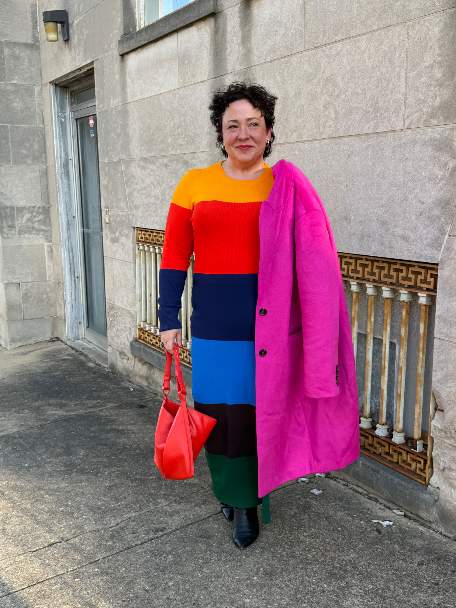 alison gary of wardrobe oxygen in a christopher john rogers for J. Crew stripe dress and ann taylor pink coat