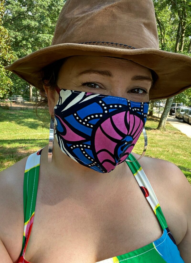 woman wearing a blue and hot pink printed cloth face mask from Kaela Kay