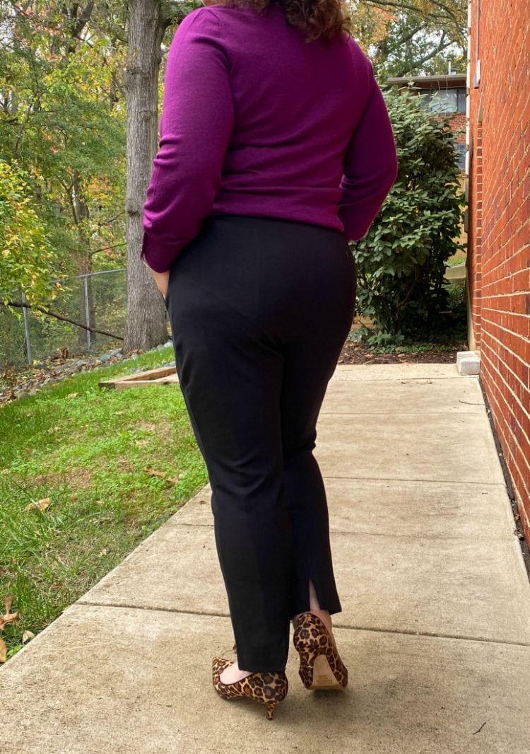 black ponte knit ankle pants as seen on a woman facing away from the camers