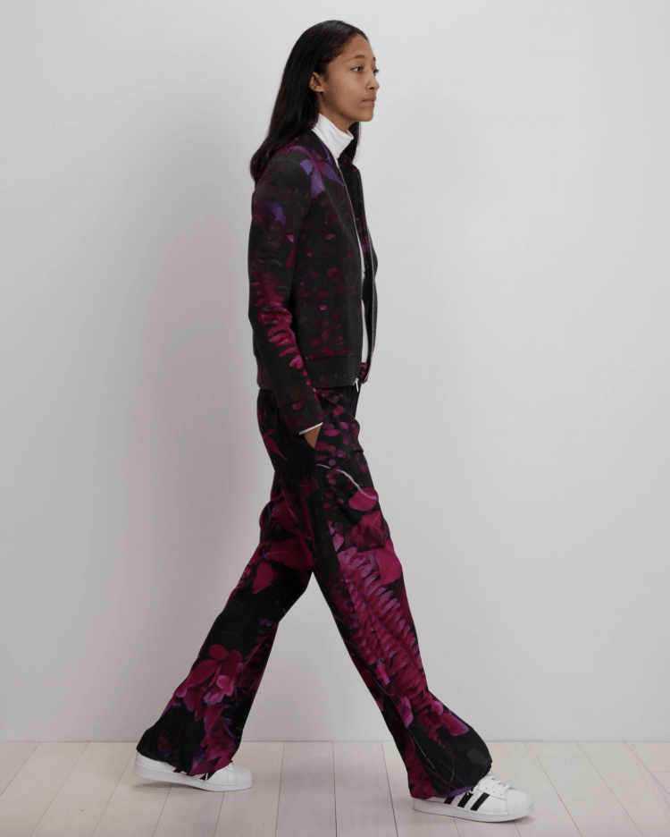 Model from tThe Kit NYC website wearing a bomber jacket and matching printed pants