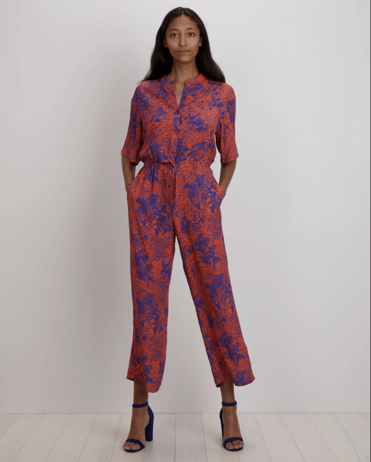 The Issa Jumpsuit in Orange Complication, as modeled on THE KIT website