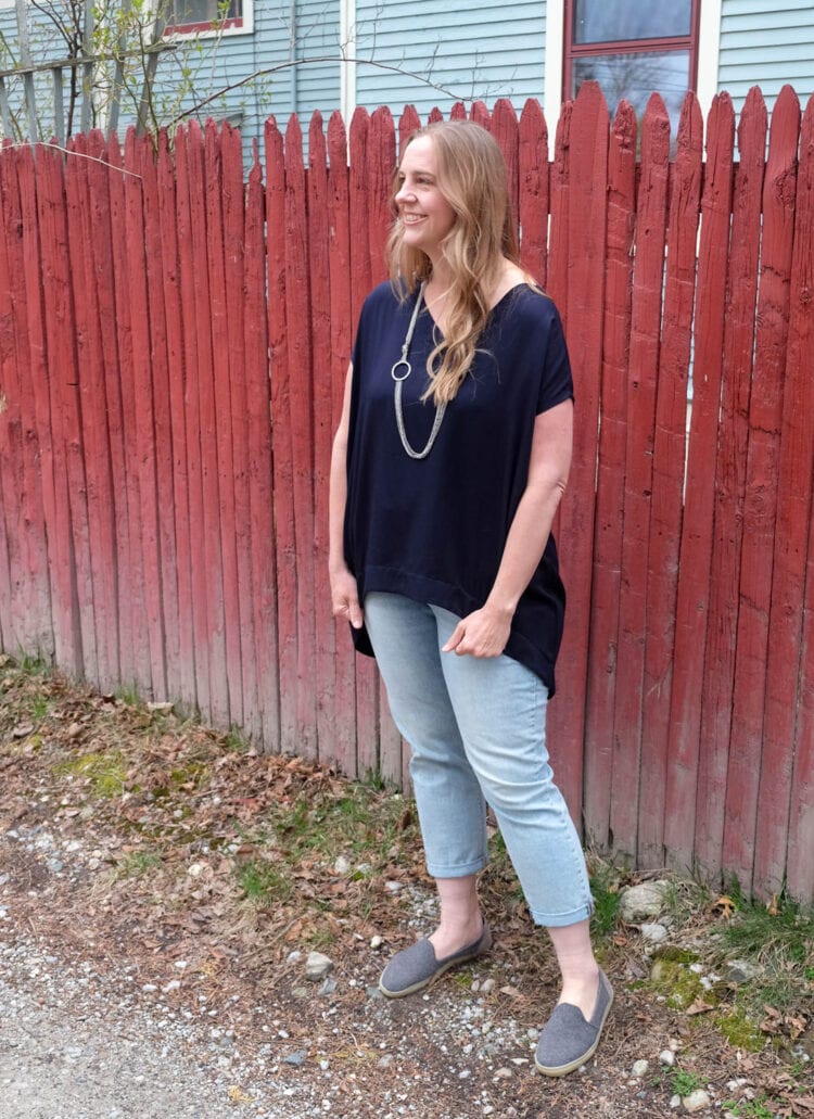 The Tiny Closet Tourist Tunic on Lissa, styled with faded ankle jeans and a long silver necklace