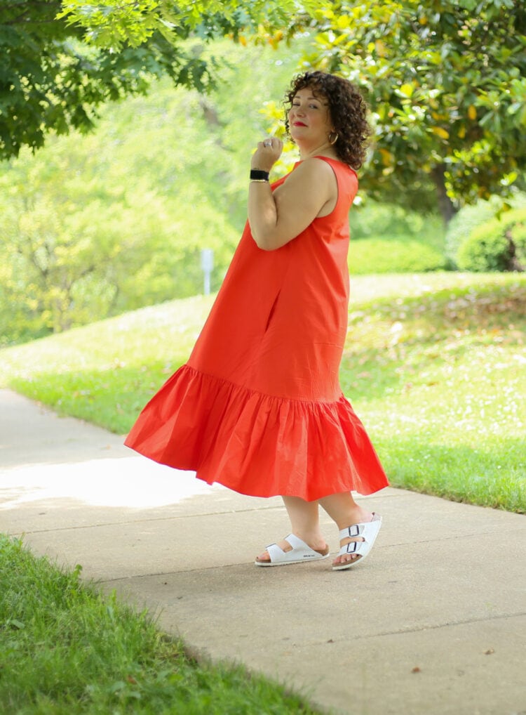 Alison in the Christopher John Rogers for Target Orange Shift Dress smiling at the camera