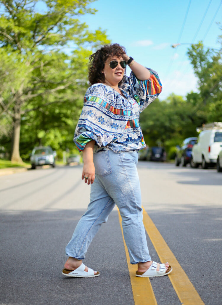 Wardrobe Oxygen in a Farm Rio blouse and Gap high rise cheeky straight jeans and white BIrkenstocks