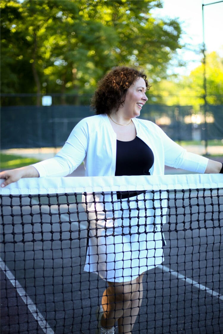 Alison of Wardrobe Oxygen in white knit bomber and skort from Talbots