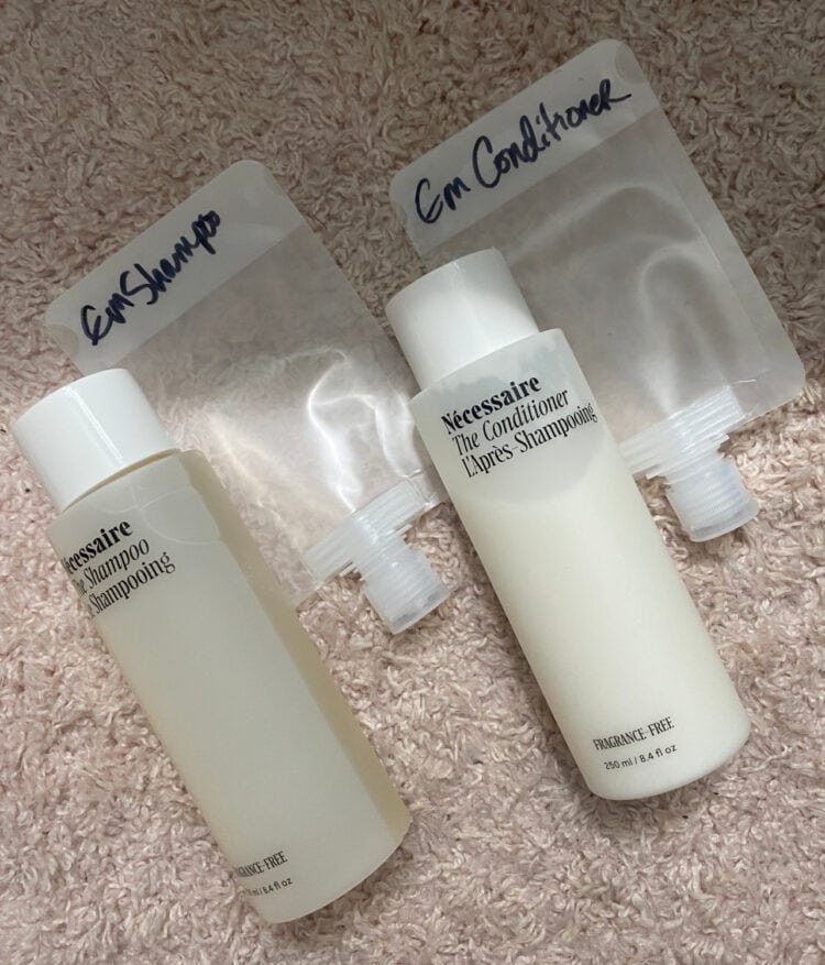 Shampoo and conditioner bottles from Necessaire next to TSA-sized plastic pouches for liquids