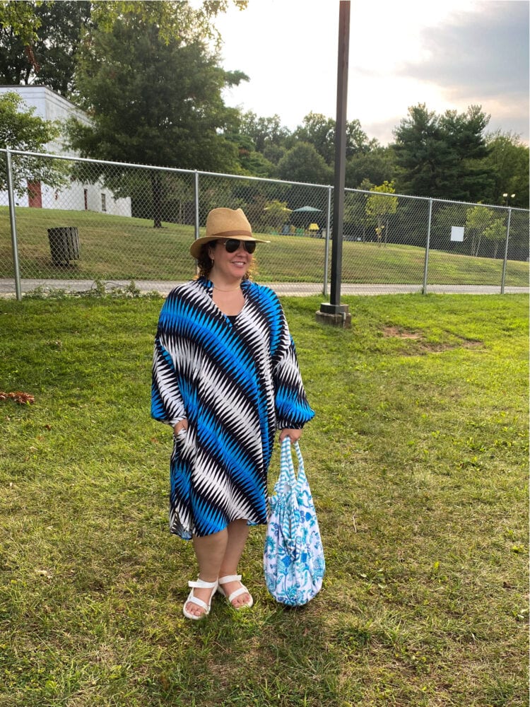 Alison in a blue and black and white graphic print sleeved caftan dress from Essentiel Antwerp