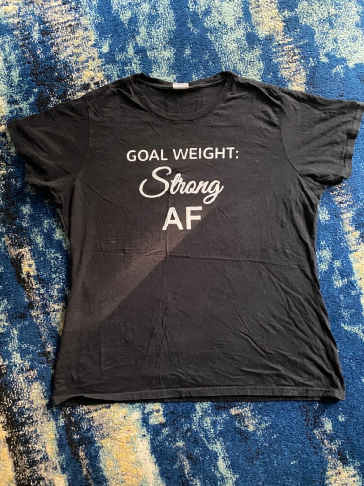 black t-shirt with the text goal weight: strong AF