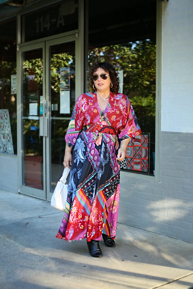 Wardrobe Oxygen in a red printed maxi dress from eShakti that has bell sleeves and a v-neckline