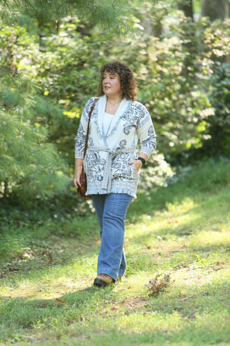 The Perfect Belted Cardigan for Fall (and it has pockets!) 1 Wardrobe Oxygen in a Chico's belted cardigan sweater with a blue print on ivory
