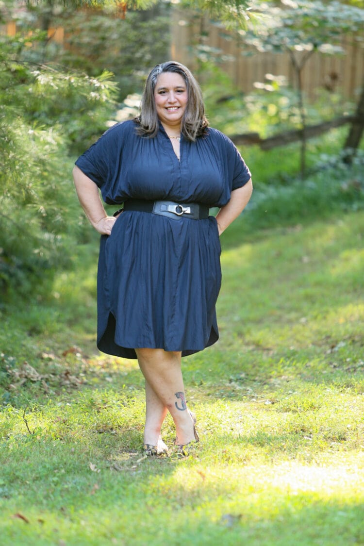 Carrie wearing the navy ever by X dress cinched with a wide black stretch belt from her own closet.