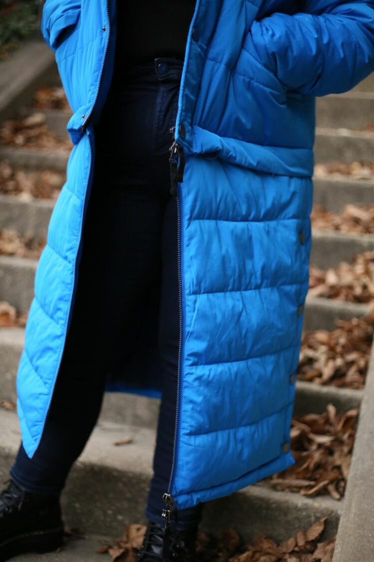 Closeup of the puffer coat and its zippers