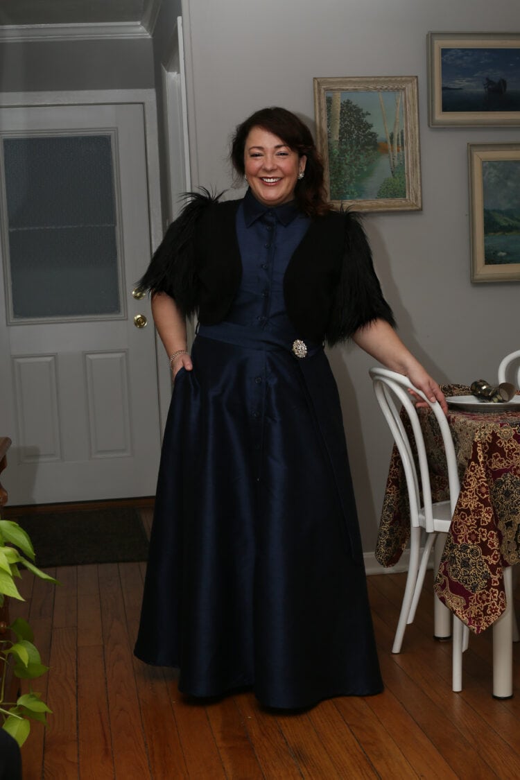 what I wore Christmas Eve was a sleeveless dupioni maxi shirtdress in navy with a black shrug over it that has faux fur sleeves