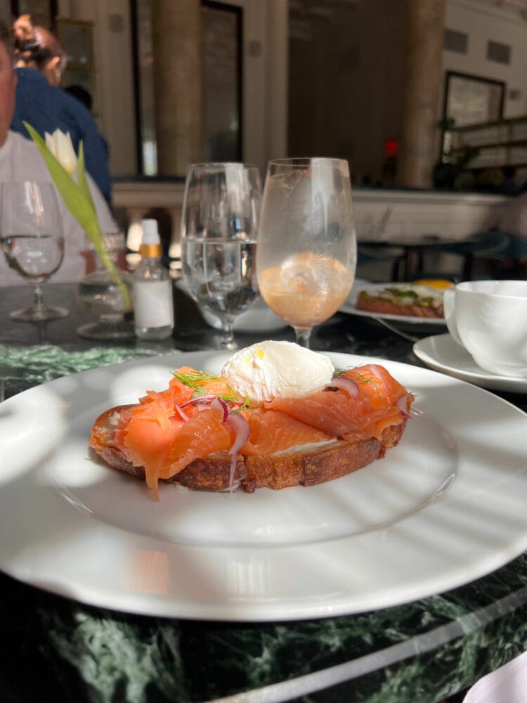 a plate showing toast with salon and creme fraiche at Cafe Riggs, a restaurant at the Hotel Riggs Washington DC