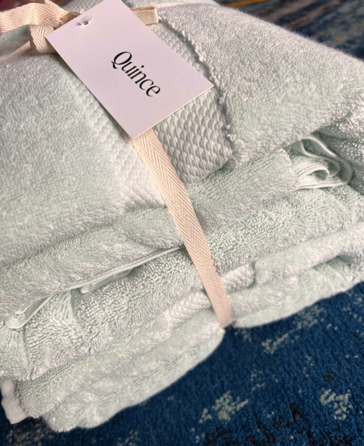quince bath sheet review showing the newly delivered towels tied with a ribbon