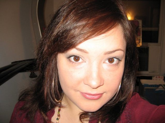 Alison Gary in 2008 wearing silver hoops and a burgundy crinkle gauze tunic from Express