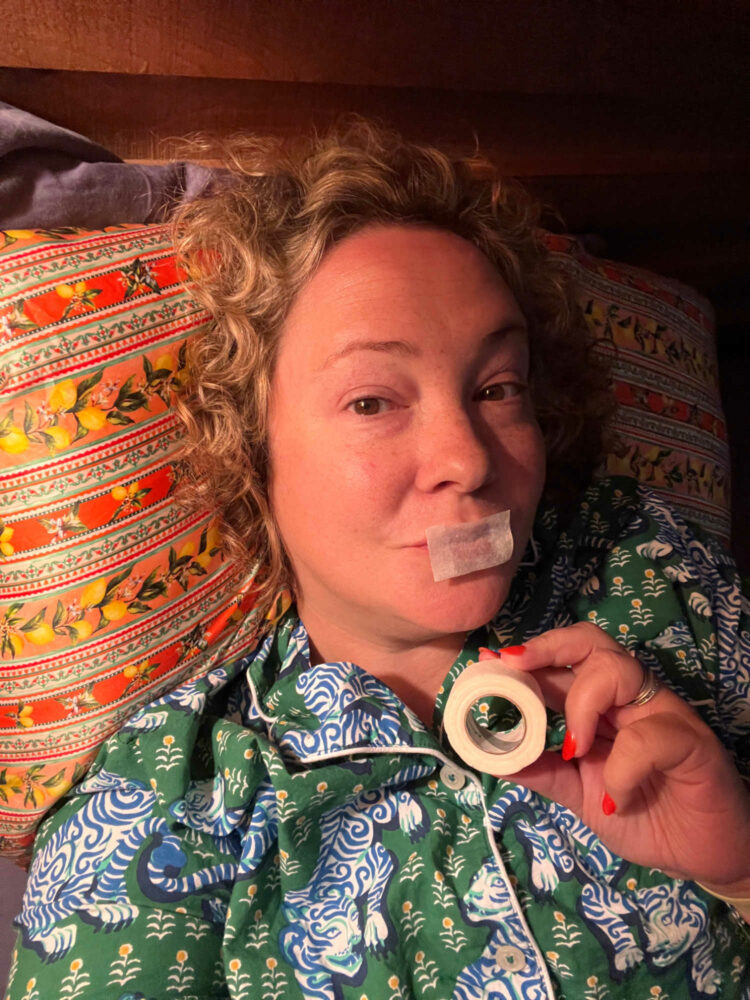 Alison Gary in Printfresh pajamas with a piece of medical tape over her lips