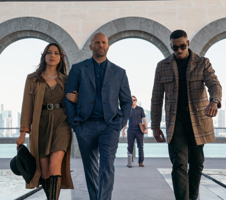 Aubrey Plaza, Jason Statham, and Bugzy Malone in the film Operation Fortune: Ruse de Guerre