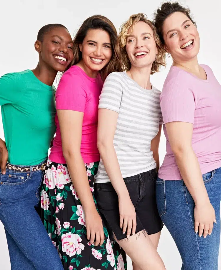 four women wearing different colored short sleeve t-shirts from the Macy's private label On 34th