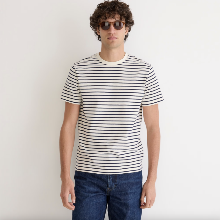 man in a white j. crew striped short sleeve t-shirt with jeans and tortoiseshell sunglasses