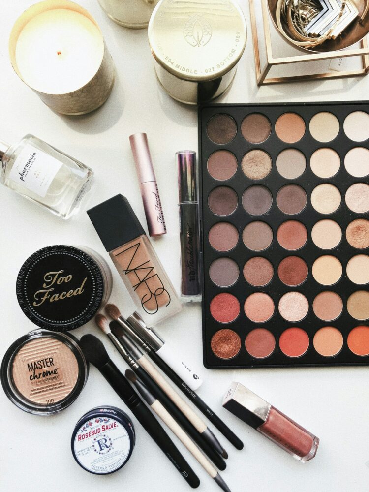 a variety of makeup products o a white table