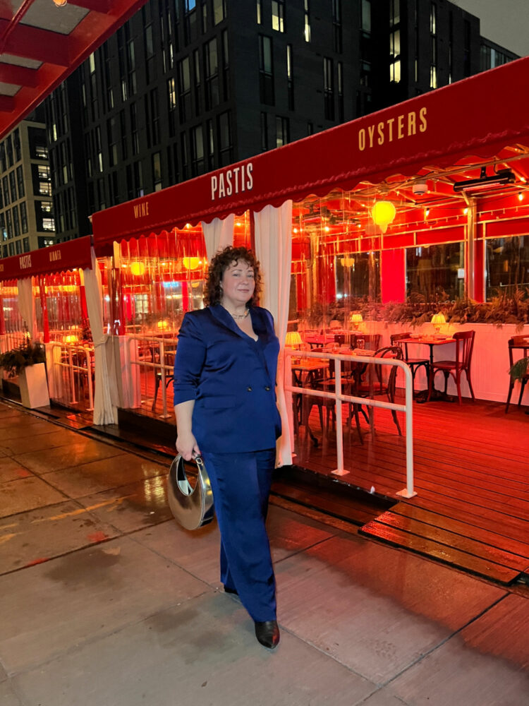 Alison Gary of Wardrobe Oxygen walking past the outdoor seating of Pastis DC in the Union Market District.