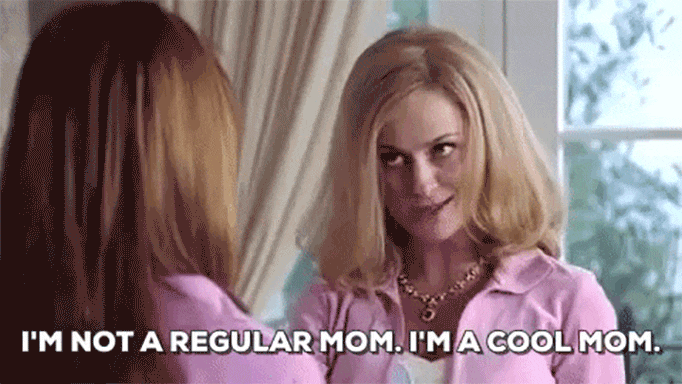 GIF of Amy POehler ib the movie Mean Girls wearing a pink hoodie and winking. The text overlay is, "I'm not a regular mom. I'm a cool mom."